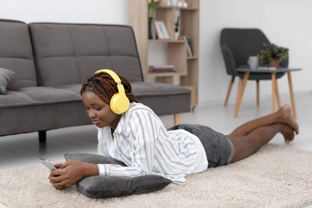 Woman listening to music and having a good time. This is how to improve your mental health..