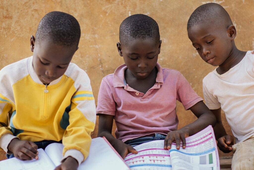 3 boys reading picture books